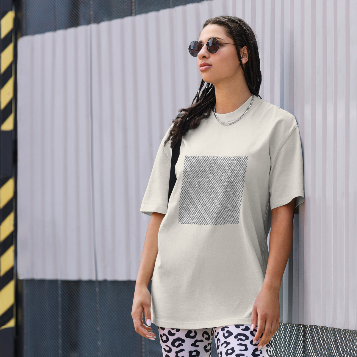 Take Me To Your Leader oversized faded tee in faded bone, front view on a women's lifestyle model (Printful mockup)