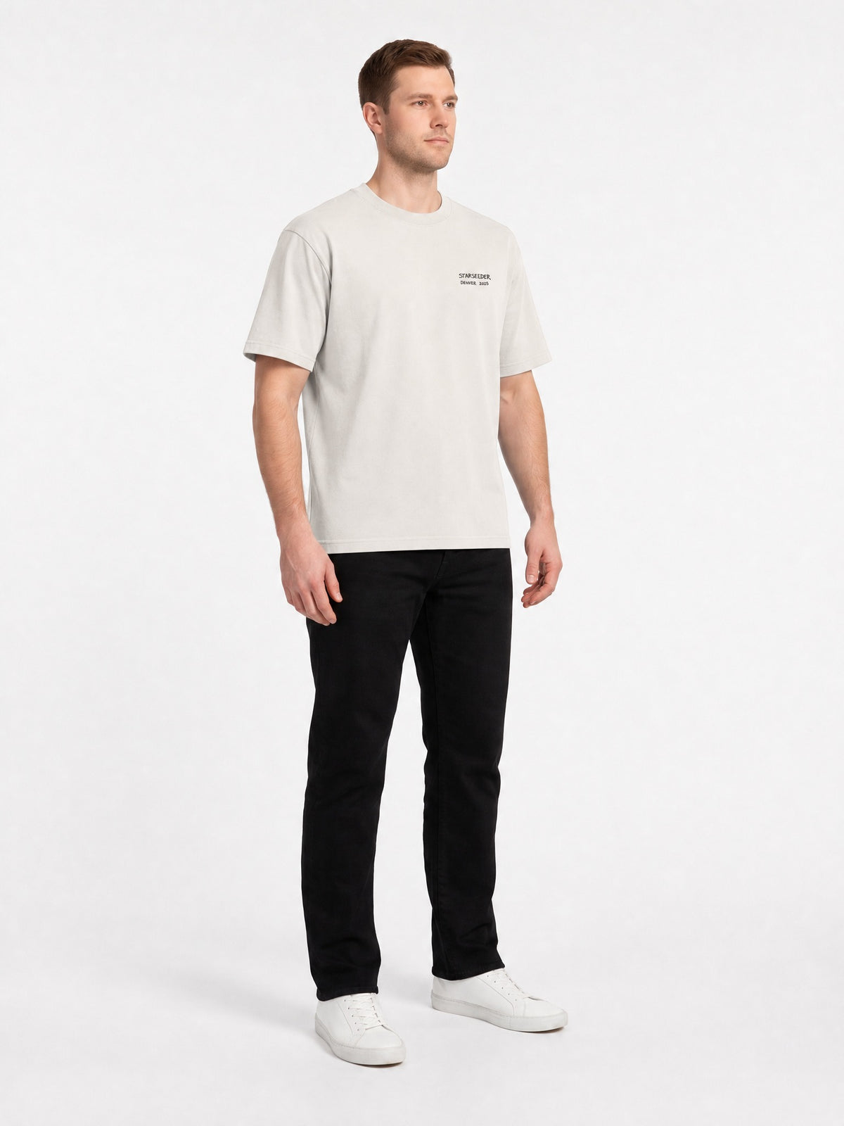 AI-generated model, no real person pictured. Happy Thanksgiving oversized faded tee in faded bone, three-quarter front view.