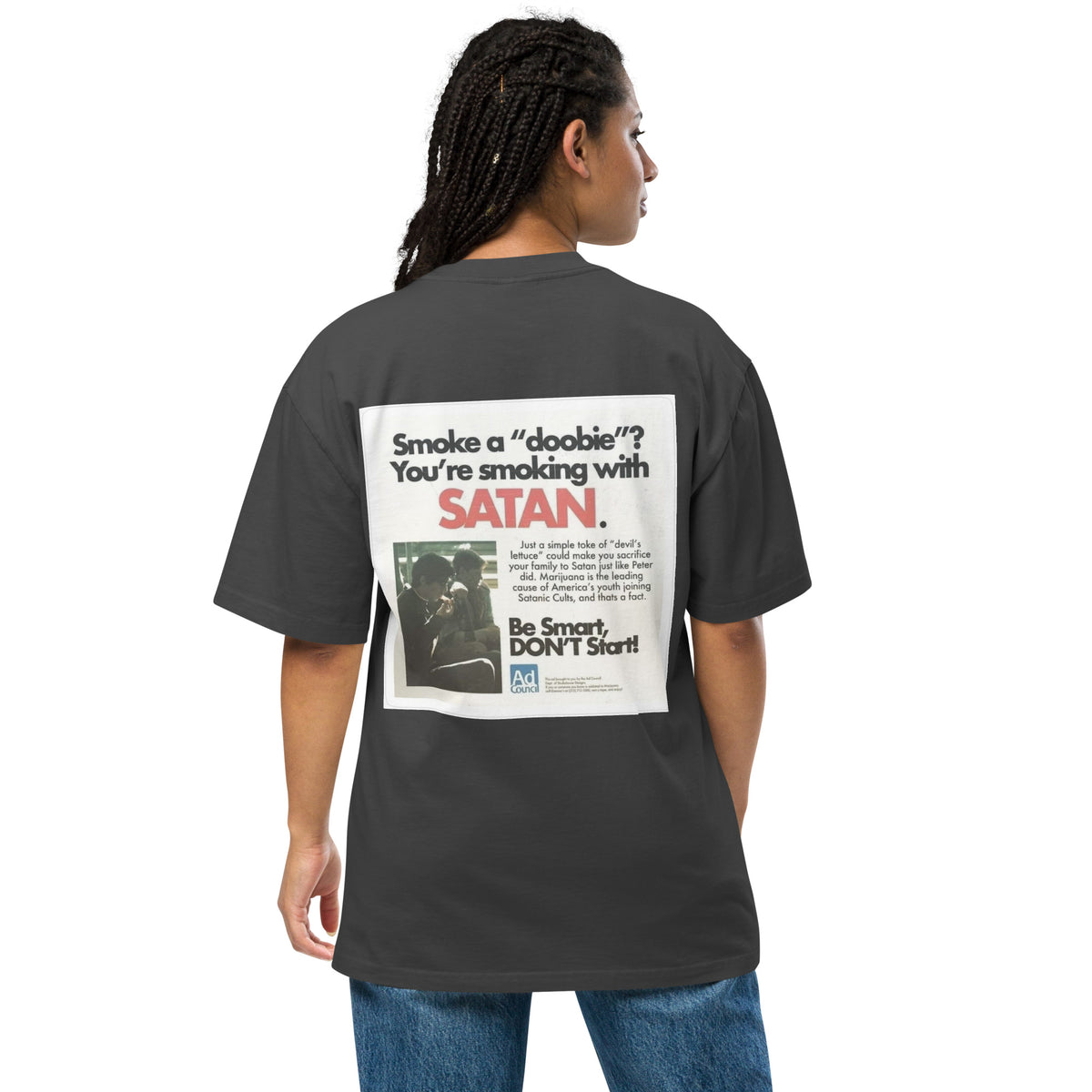 Not Even Once oversized faded tee in faded black, back view on a women's studio model (Printful mockup)