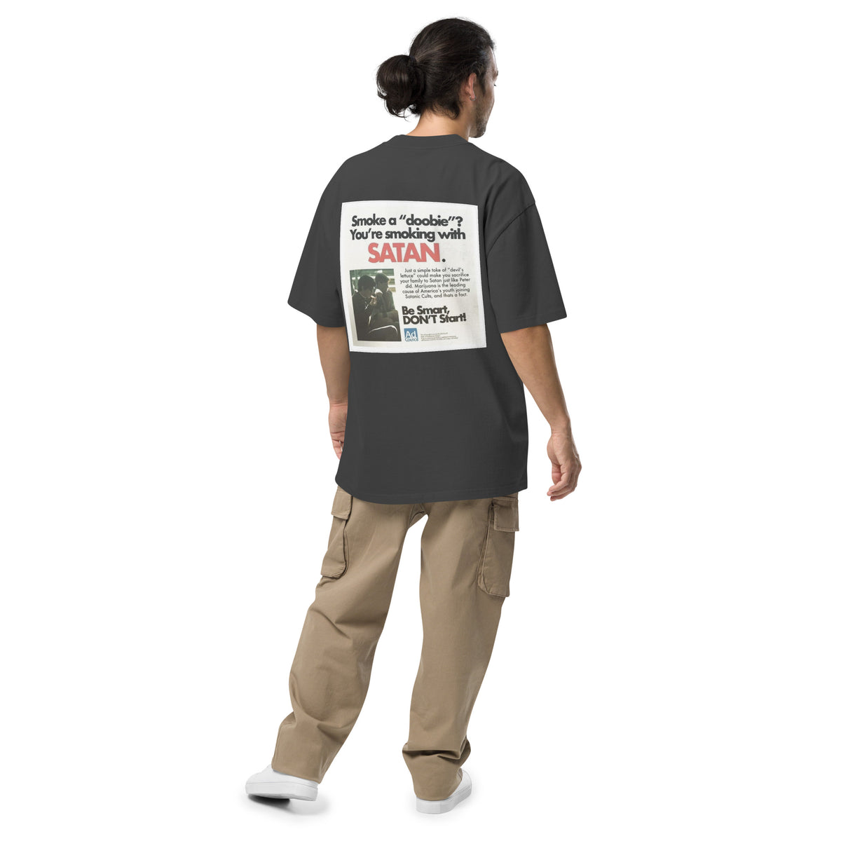 Not Even Once oversized faded tee in faded black, back view on a men's studio model (Printful mockup)
