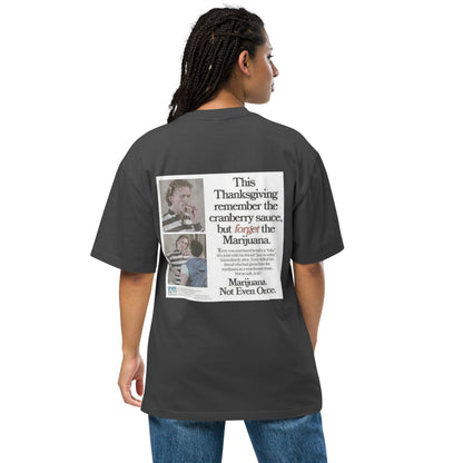 Happy Thanksgiving oversized faded tee in faded black, back view on a women's studio model (Printful mockup)