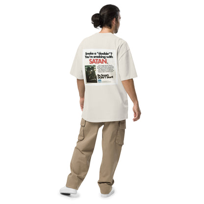 Not Even Once oversized faded tee in faded bone, back view on a men's studio model (Printful mockup)