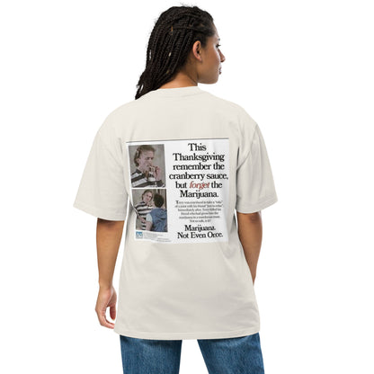 Happy Thanksgiving oversized faded tee in faded bone, back view on a women's studio model (Printful mockup)