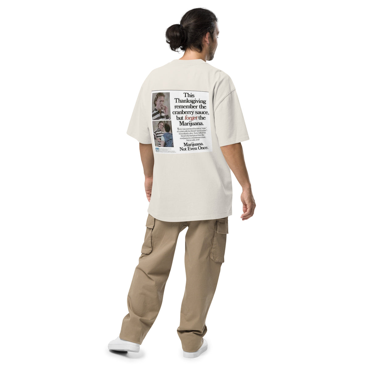 Happy Thanksgiving oversized faded tee in faded bone, back view on a men's studio model (Printful mockup)