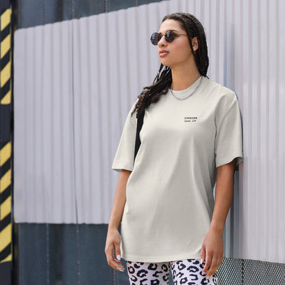 Not Even Once oversized faded tee in faded bone, front view on a women's lifestyle model (Printful mockup)