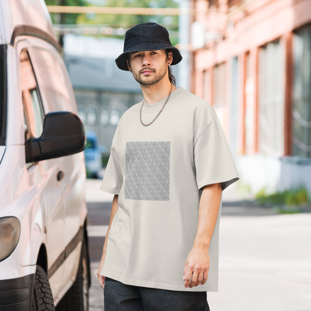 Take Me To Your Leader oversized faded tee in faded bone, front view on a men's lifestyle model (Printful mockup)