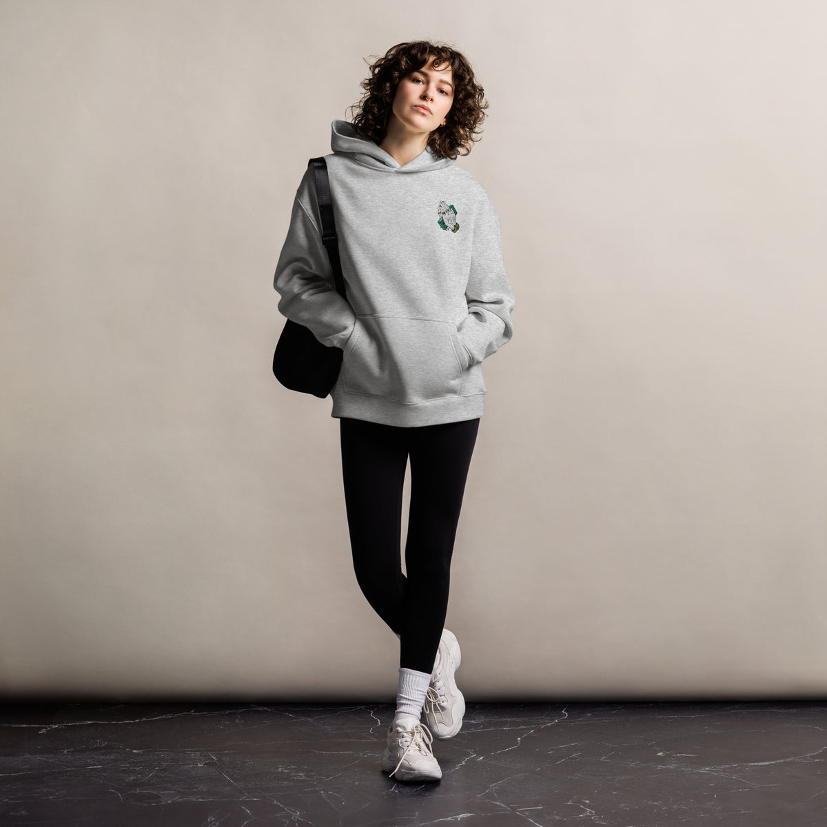 Pray For Me unisex oversized hoodie in athletic heather, front view on a women's lifestyle model (Printful mockup)